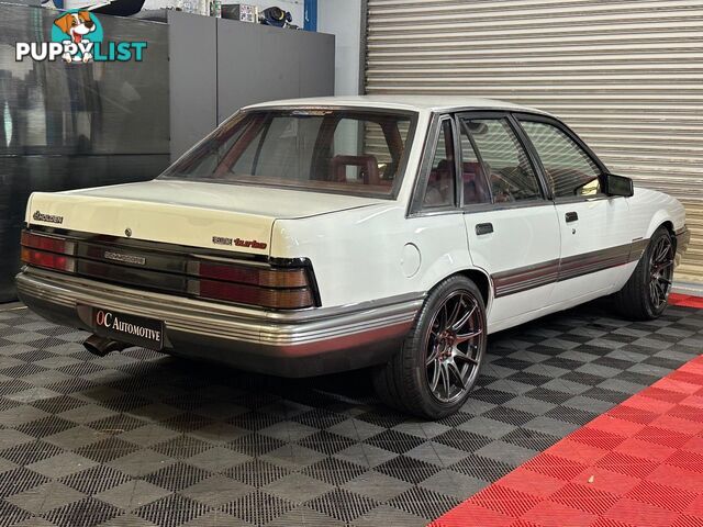 1986 HOLDEN COMMODORE SL VL 4D SEDAN