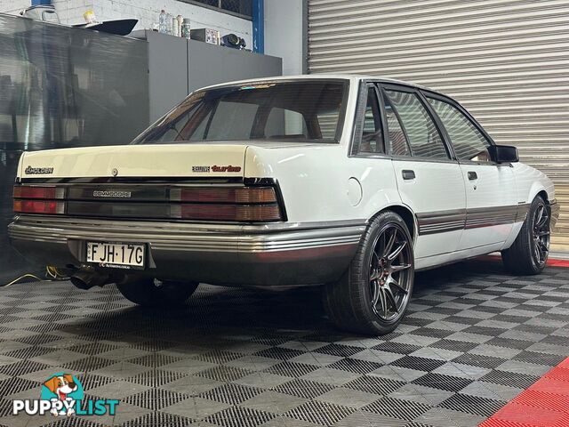 1986 HOLDEN COMMODORE SL VL 4D SEDAN