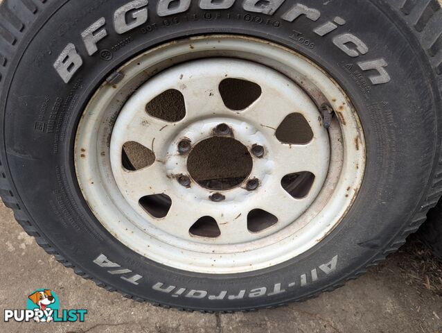 Three Off Road tyres and rims