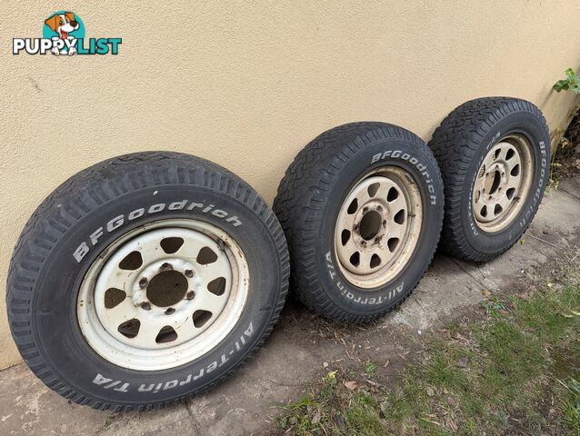 Three Off Road tyres and rims