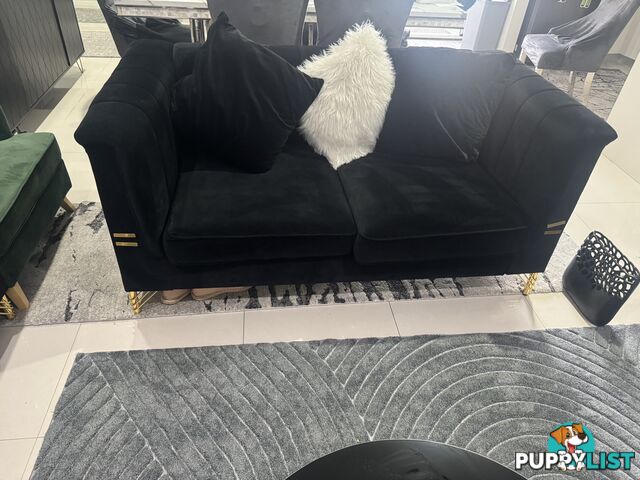 Black velevet  with gold leg lounge excellent condition less than 6 months old