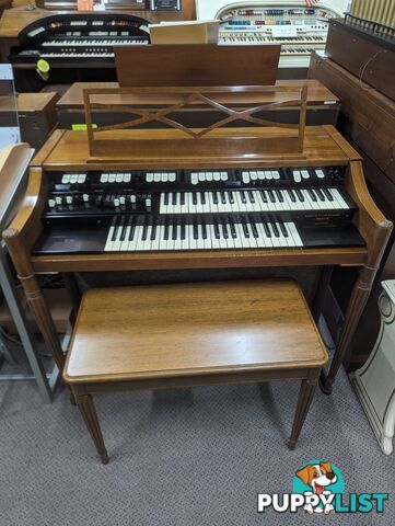 Hammond M100 Series Tone Wheel Organ - M-111, tradition style in walnut.