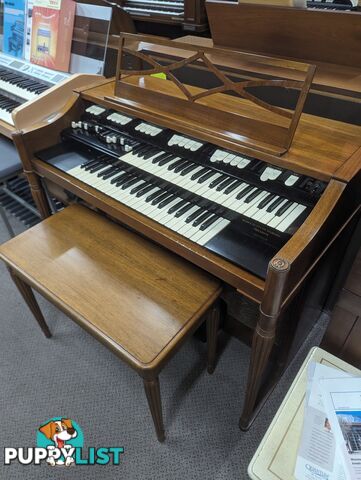 Hammond M100 Series Tone Wheel Organ - M-111, tradition style in walnut.