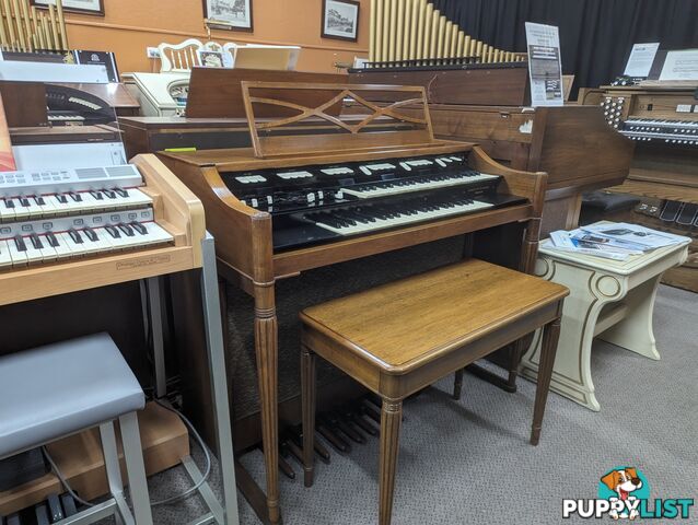 Hammond M100 Series Tone Wheel Organ - M-111, tradition style in walnut.