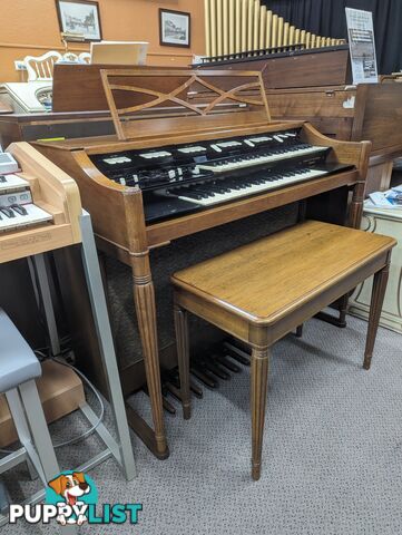 Hammond M100 Series Tone Wheel Organ - M-111, tradition style in walnut.