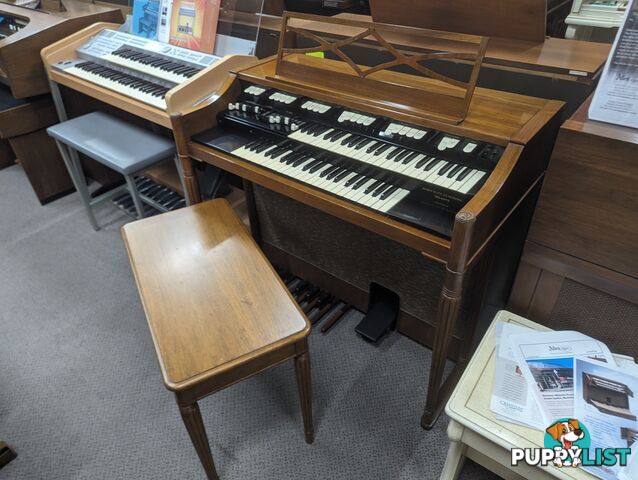 Hammond M100 Series Tone Wheel Organ - M-111, tradition style in walnut.