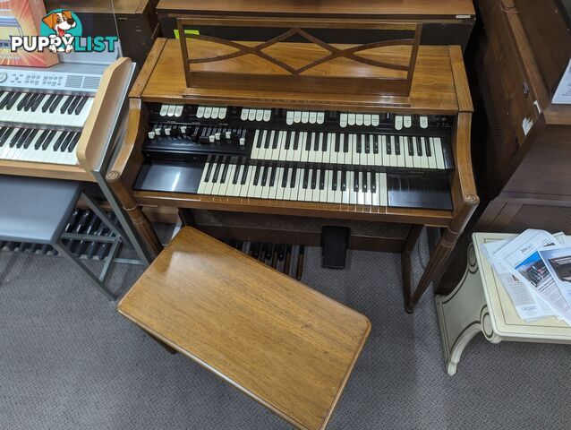 Hammond M100 Series Tone Wheel Organ - M-111, tradition style in walnut.