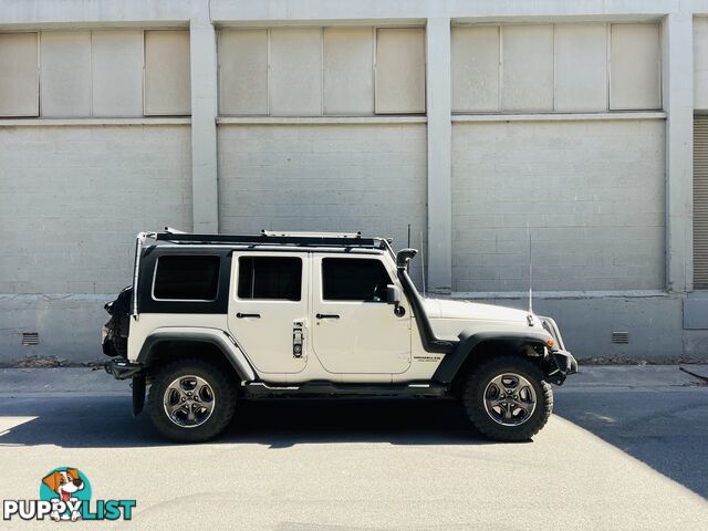 2010 Jeep Wrangler Unlimited Sport (4x4) 4D Softtop And Hard Top Wagon 4 Speed Automatic