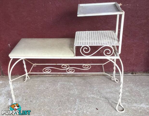 Wrought iron telephone table Slight surface rust. No damage to