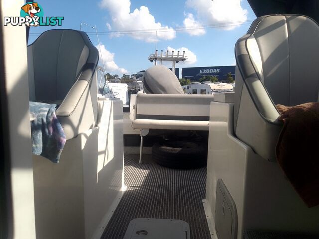 USED HAINES HUNTER 680C HALF CABIN WITH A 2005 SUZUKI 200HP 4 STROKE OUTBOARD ON A 2020 SWIFTCO DUAL AXLE TRAILER