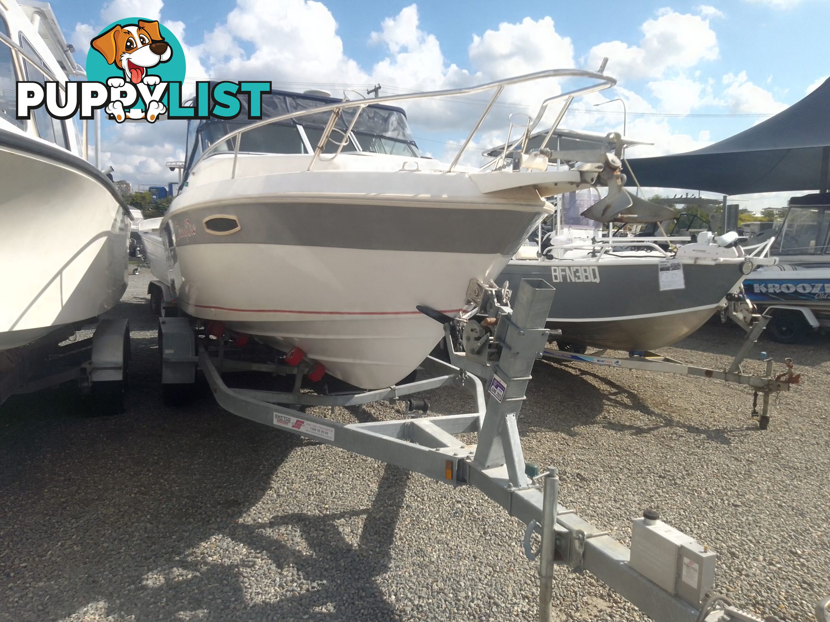 USED HAINES HUNTER 680C HALF CABIN WITH A 2005 SUZUKI 200HP 4 STROKE OUTBOARD ON A 2020 SWIFTCO DUAL AXLE TRAILER