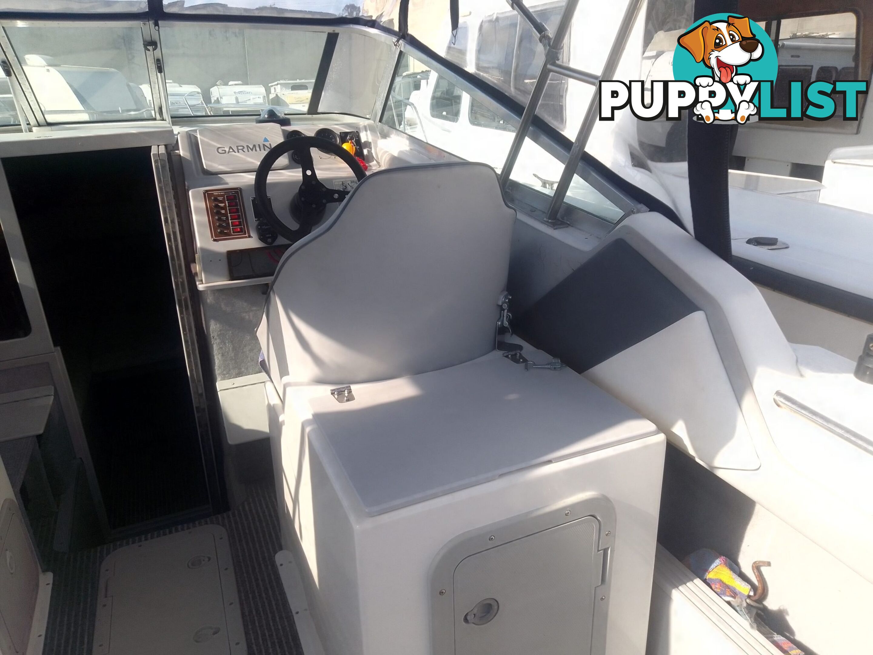 USED HAINES HUNTER 680C HALF CABIN WITH A 2005 SUZUKI 200HP 4 STROKE OUTBOARD ON A 2020 SWIFTCO DUAL AXLE TRAILER