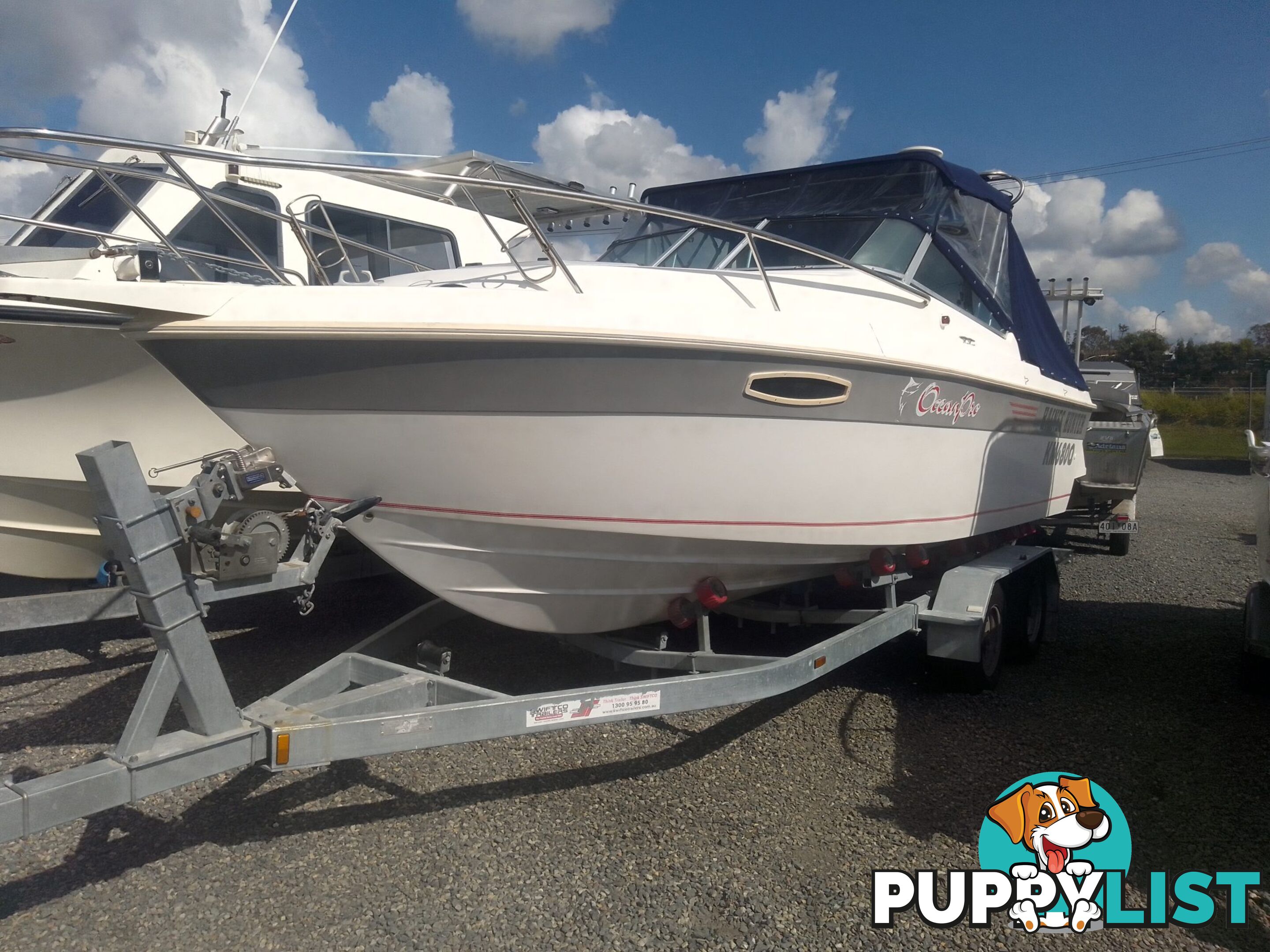 USED HAINES HUNTER 680C HALF CABIN WITH A 2005 SUZUKI 200HP 4 STROKE OUTBOARD ON A 2020 SWIFTCO DUAL AXLE TRAILER