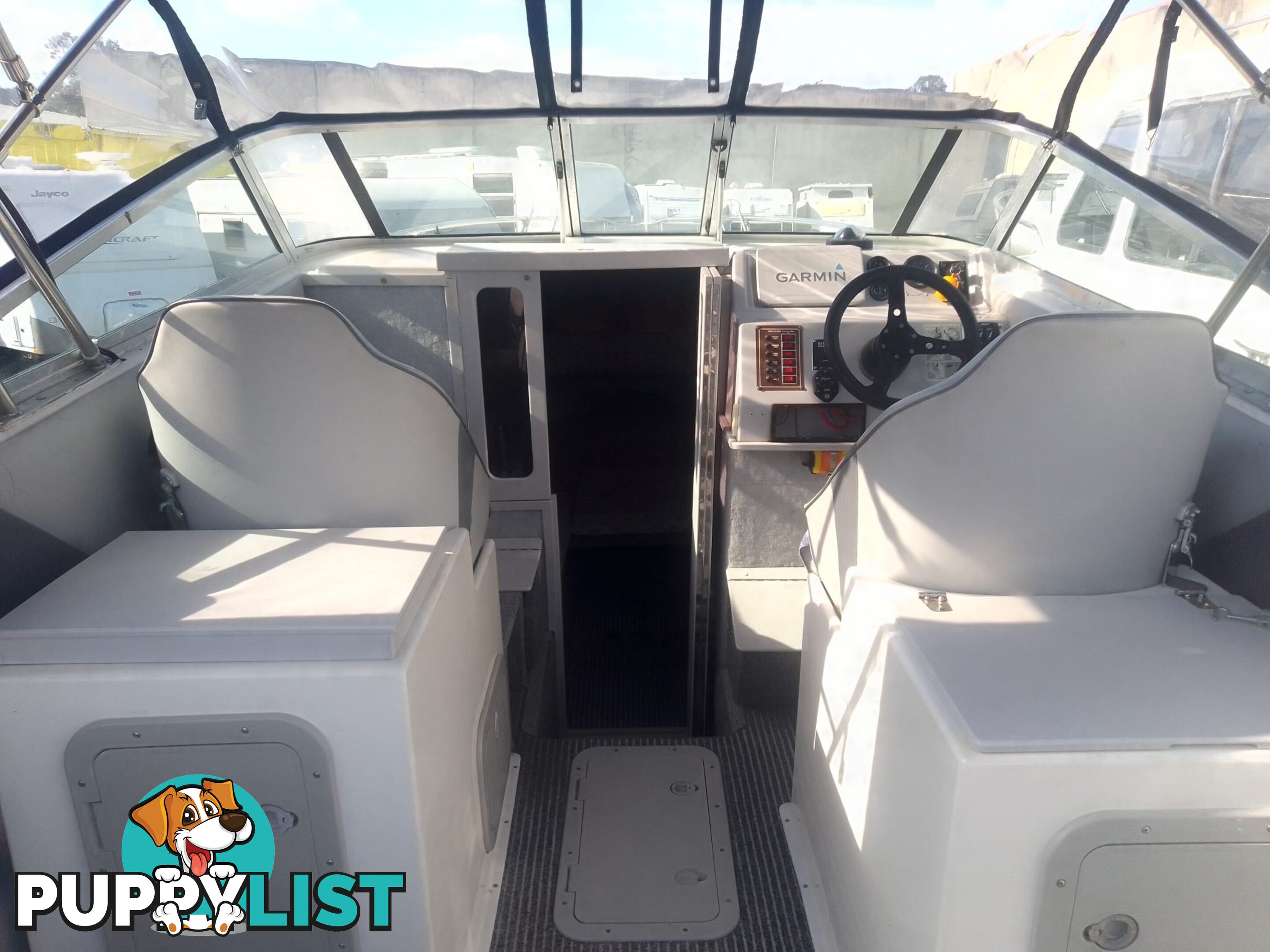 USED HAINES HUNTER 680C HALF CABIN WITH A 2005 SUZUKI 200HP 4 STROKE OUTBOARD ON A 2020 SWIFTCO DUAL AXLE TRAILER