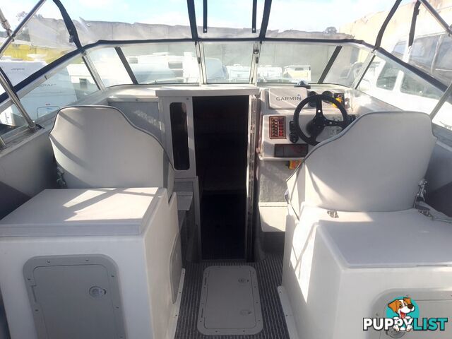 USED HAINES HUNTER 680C HALF CABIN WITH A 2005 SUZUKI 200HP 4 STROKE OUTBOARD ON A 2020 SWIFTCO DUAL AXLE TRAILER