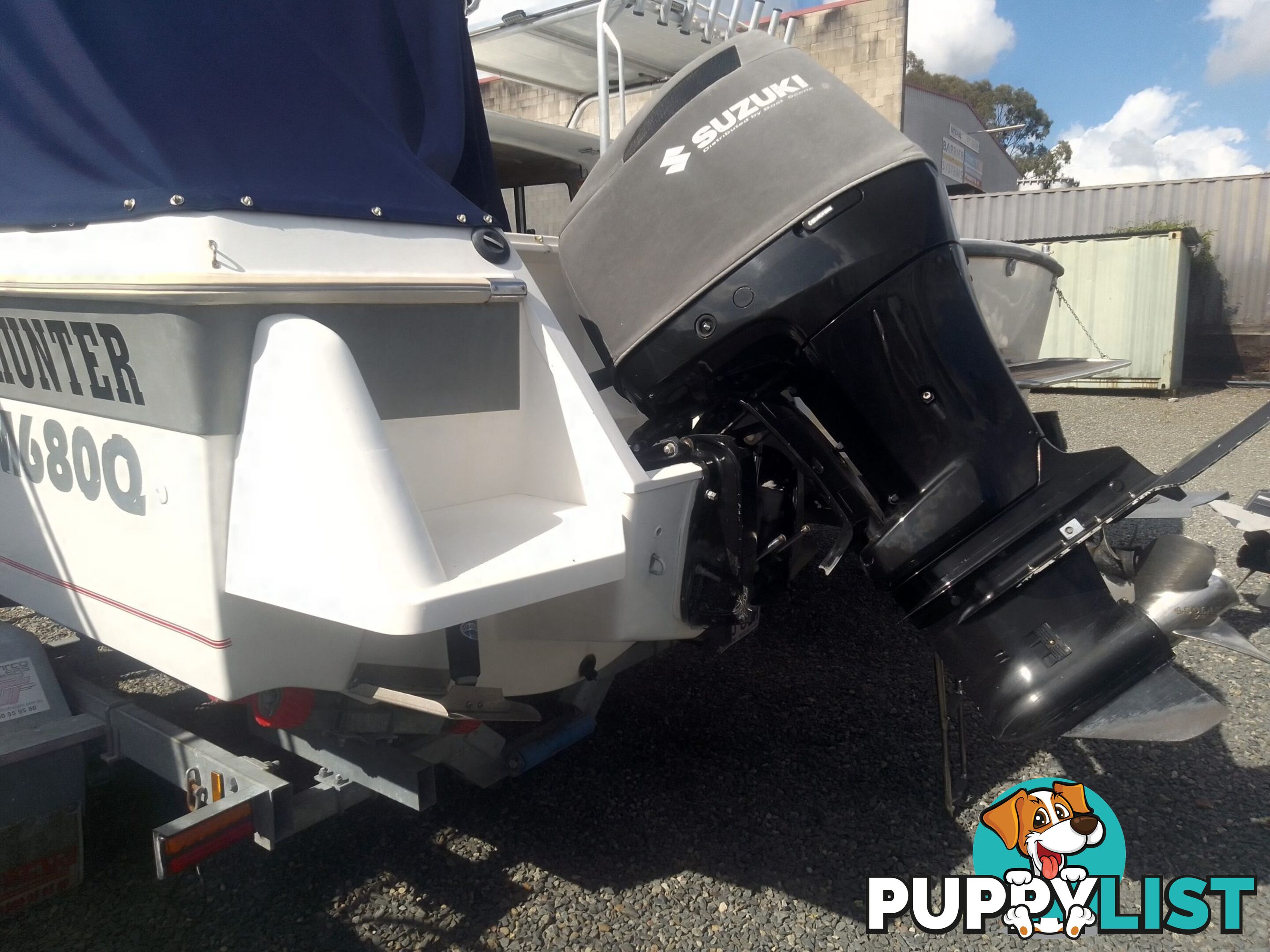 USED HAINES HUNTER 680C HALF CABIN WITH A 2005 SUZUKI 200HP 4 STROKE OUTBOARD ON A 2020 SWIFTCO DUAL AXLE TRAILER
