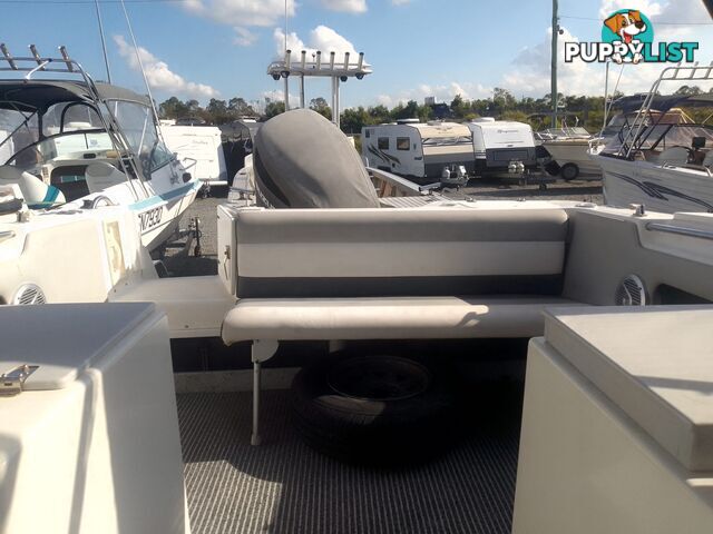 USED HAINES HUNTER 680C HALF CABIN WITH A 2005 SUZUKI 200HP 4 STROKE OUTBOARD ON A 2020 SWIFTCO DUAL AXLE TRAILER