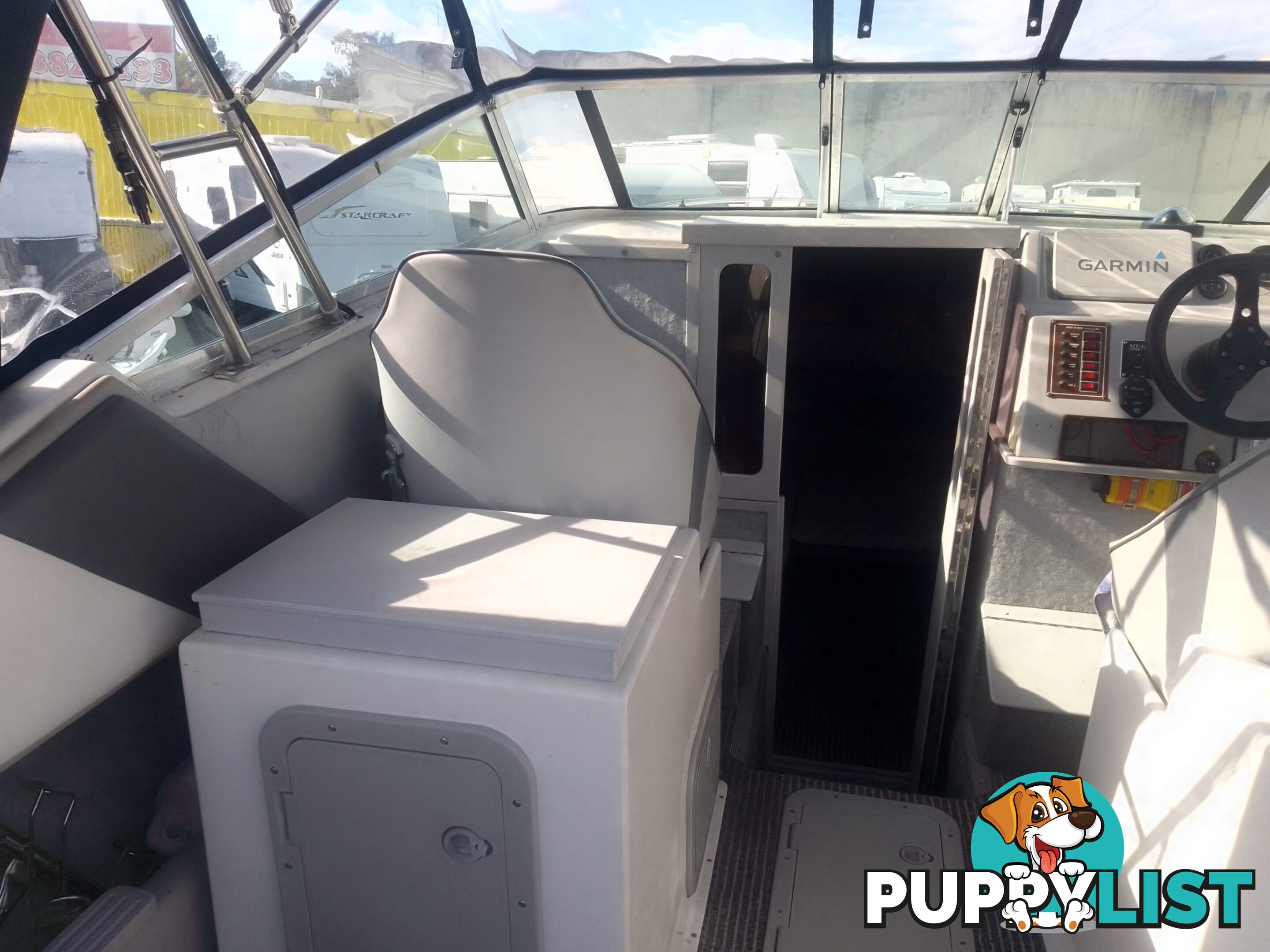 USED HAINES HUNTER 680C HALF CABIN WITH A 2005 SUZUKI 200HP 4 STROKE OUTBOARD ON A 2020 SWIFTCO DUAL AXLE TRAILER