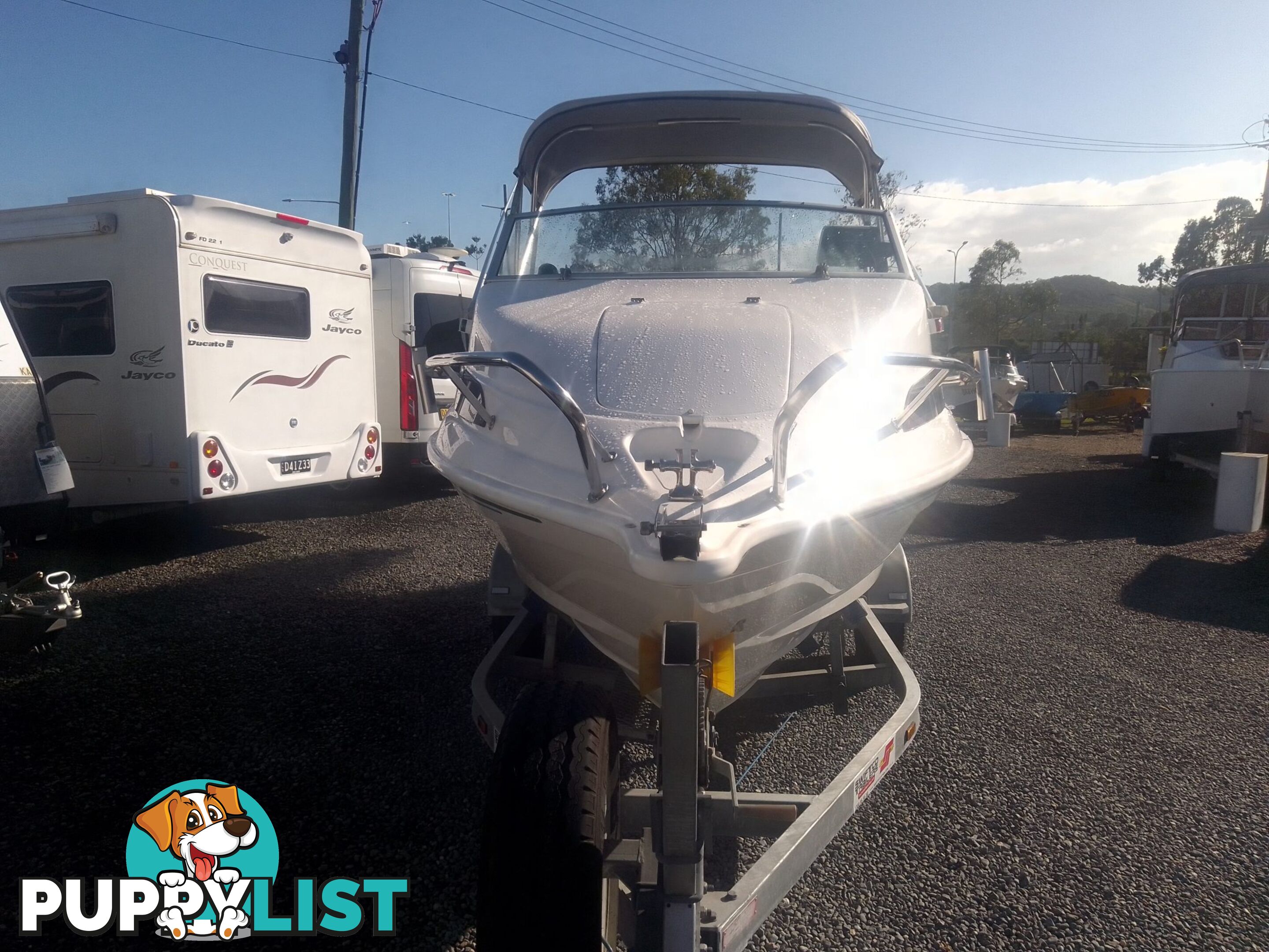 USED SAVAGE TASMAN 5.2 MT HALF CABIN 2005 POWERED BY A 115 HP SUZUKI 4 STROKE 2005 DONE 205 HOURS ON A 2017 MULTI ROLLER TRAILER