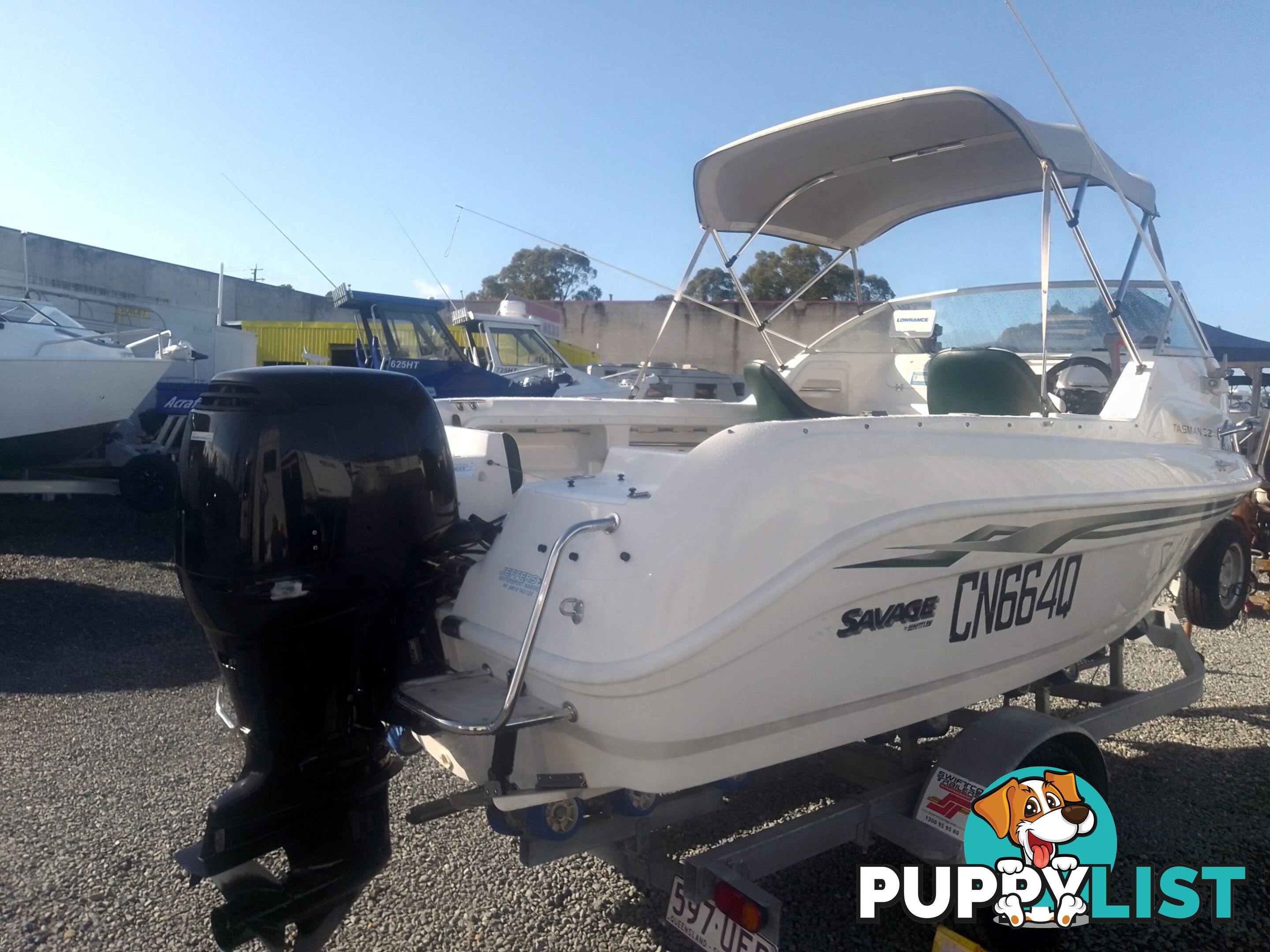 USED SAVAGE TASMAN 5.2 MT HALF CABIN 2005 POWERED BY A 115 HP SUZUKI 4 STROKE 2005 DONE 205 HOURS ON A 2017 MULTI ROLLER TRAILER