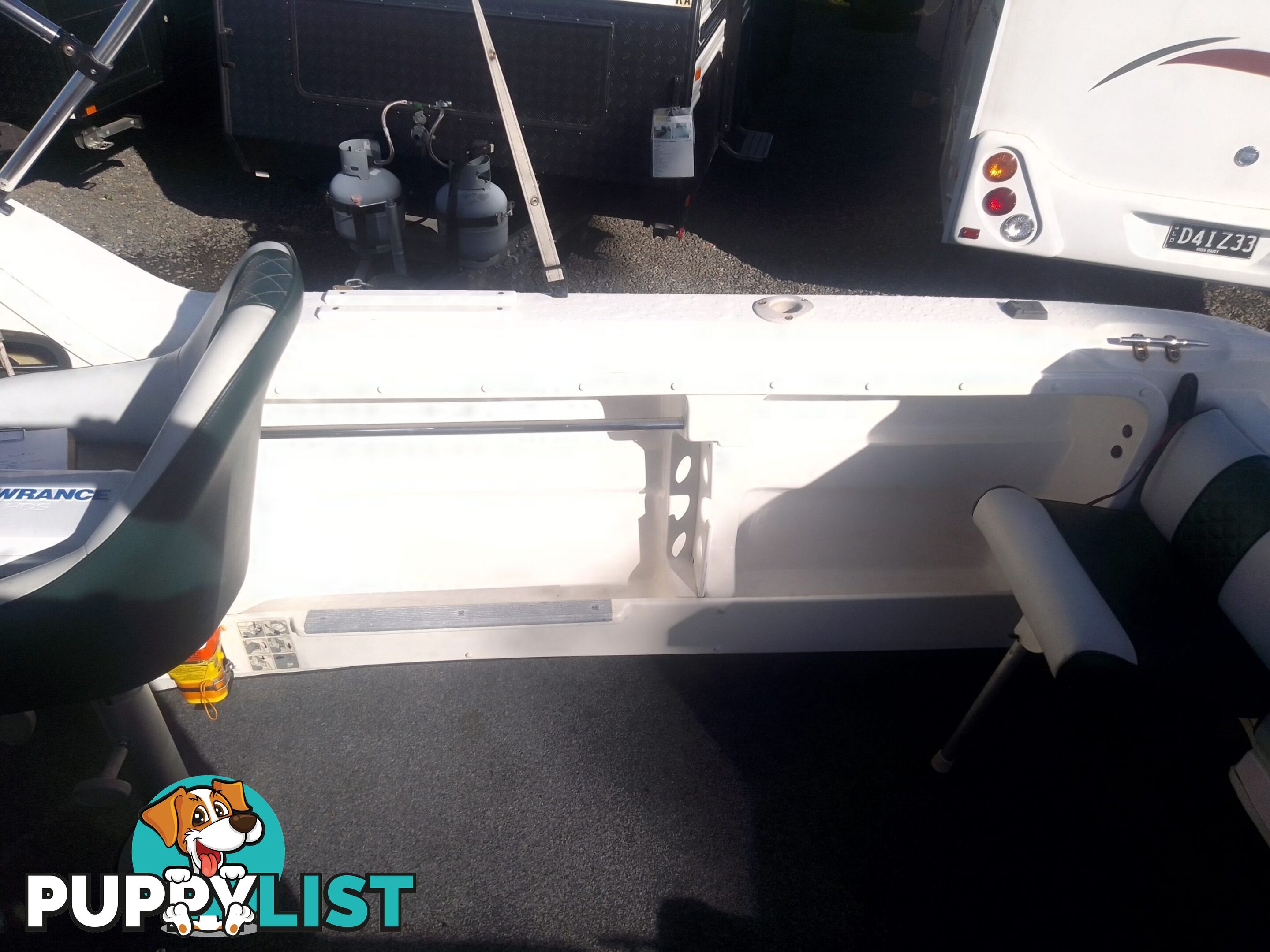 USED SAVAGE TASMAN 5.2 MT HALF CABIN 2005 POWERED BY A 115 HP SUZUKI 4 STROKE 2005 DONE 205 HOURS ON A 2017 MULTI ROLLER TRAILER