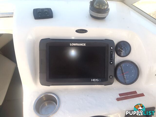 USED SAVAGE TASMAN 5.2 MT HALF CABIN 2005 POWERED BY A 115 HP SUZUKI 4 STROKE 2005 DONE 205 HOURS ON A 2017 MULTI ROLLER TRAILER