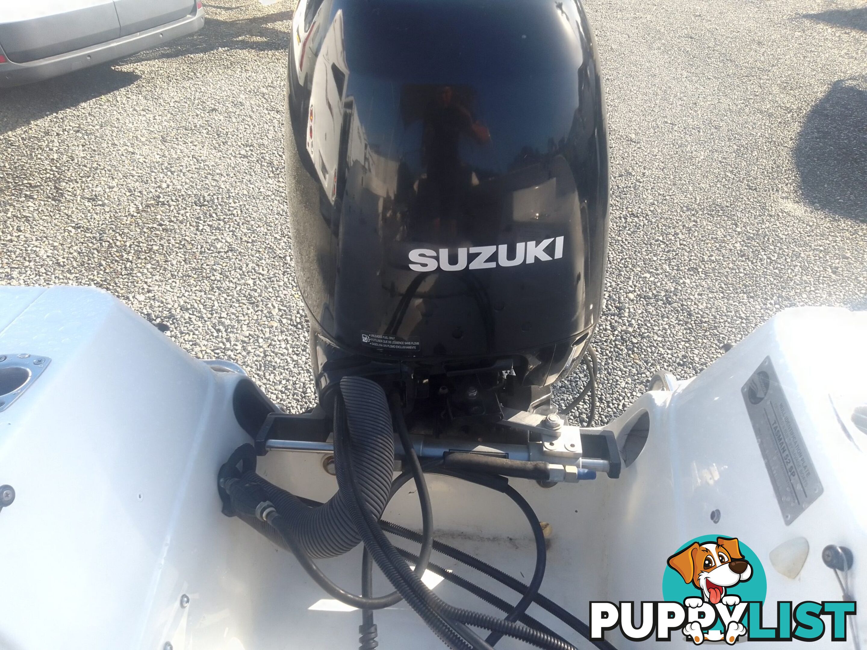 USED SAVAGE TASMAN 5.2 MT HALF CABIN 2005 POWERED BY A 115 HP SUZUKI 4 STROKE 2005 DONE 205 HOURS ON A 2017 MULTI ROLLER TRAILER