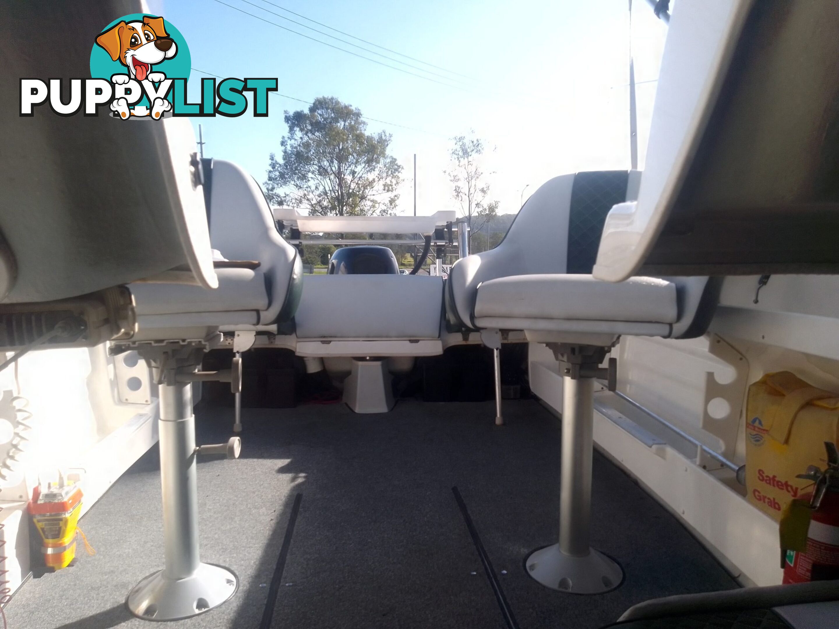 USED SAVAGE TASMAN 5.2 MT HALF CABIN 2005 POWERED BY A 115 HP SUZUKI 4 STROKE 2005 DONE 205 HOURS ON A 2017 MULTI ROLLER TRAILER