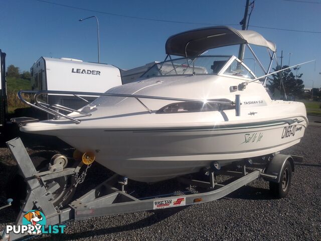 USED SAVAGE TASMAN 5.2 MT HALF CABIN 2005 POWERED BY A 115 HP SUZUKI 4 STROKE 2005 DONE 205 HOURS ON A 2017 MULTI ROLLER TRAILER