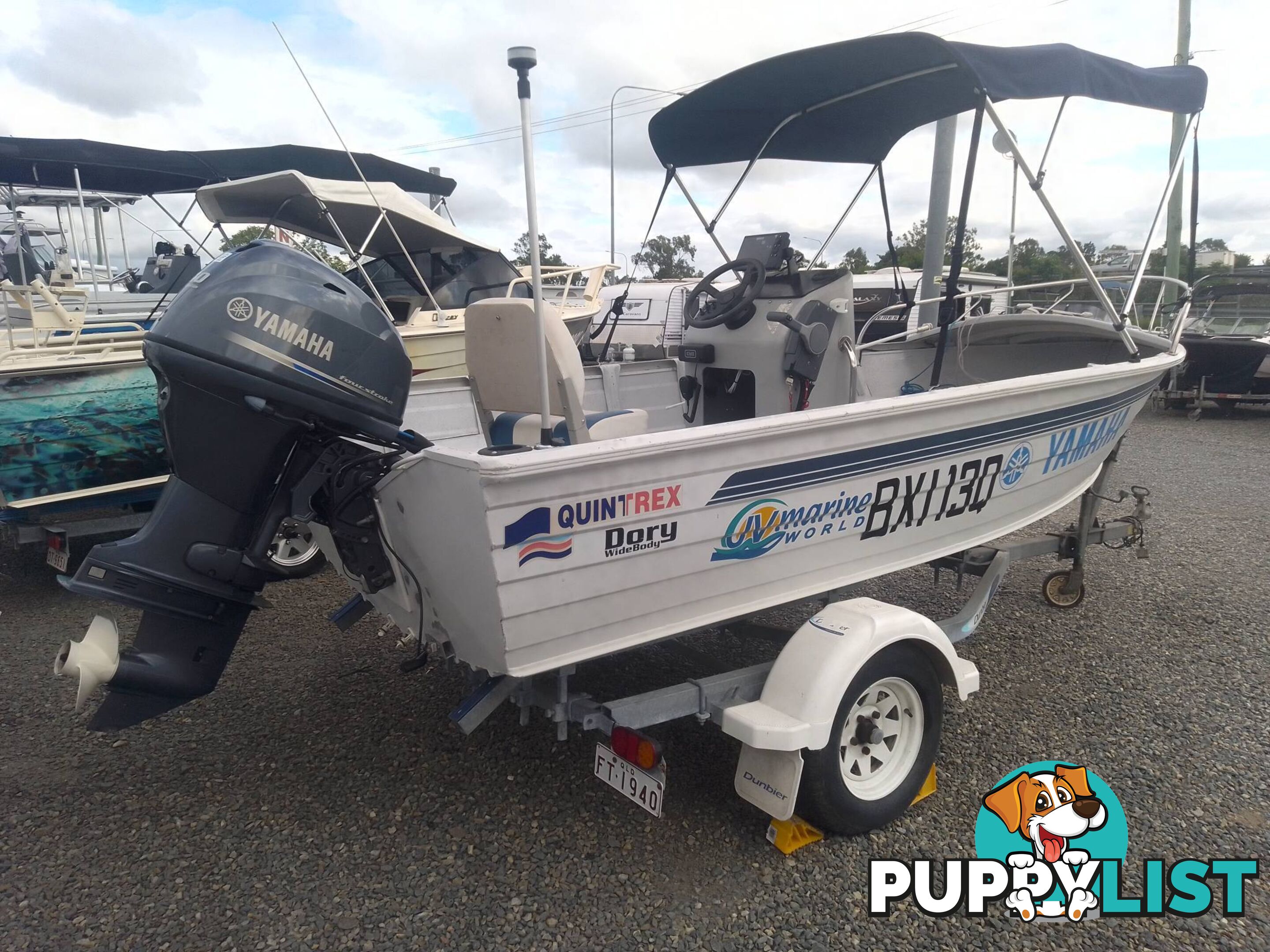 USED 2002 QUINTREX 4.2M CENTRE CONSOLE WIDE BODY DORY WITH A 40HP YAMAHA FOUR STROKE OUTBOARD ON A 2007 DUNBIER TRAILER.