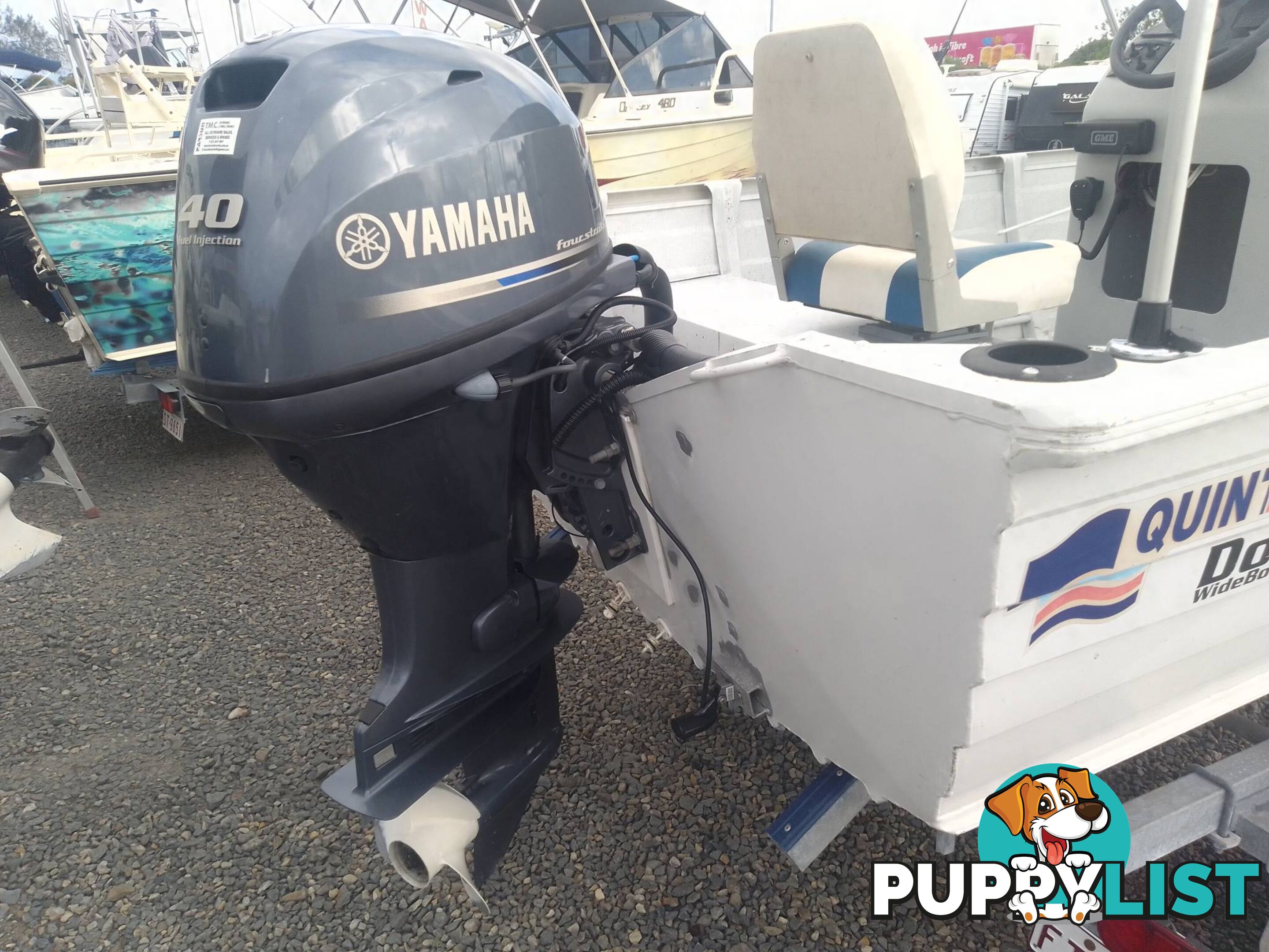 USED 2002 QUINTREX 4.2M CENTRE CONSOLE WIDE BODY DORY WITH A 40HP YAMAHA FOUR STROKE OUTBOARD ON A 2007 DUNBIER TRAILER.