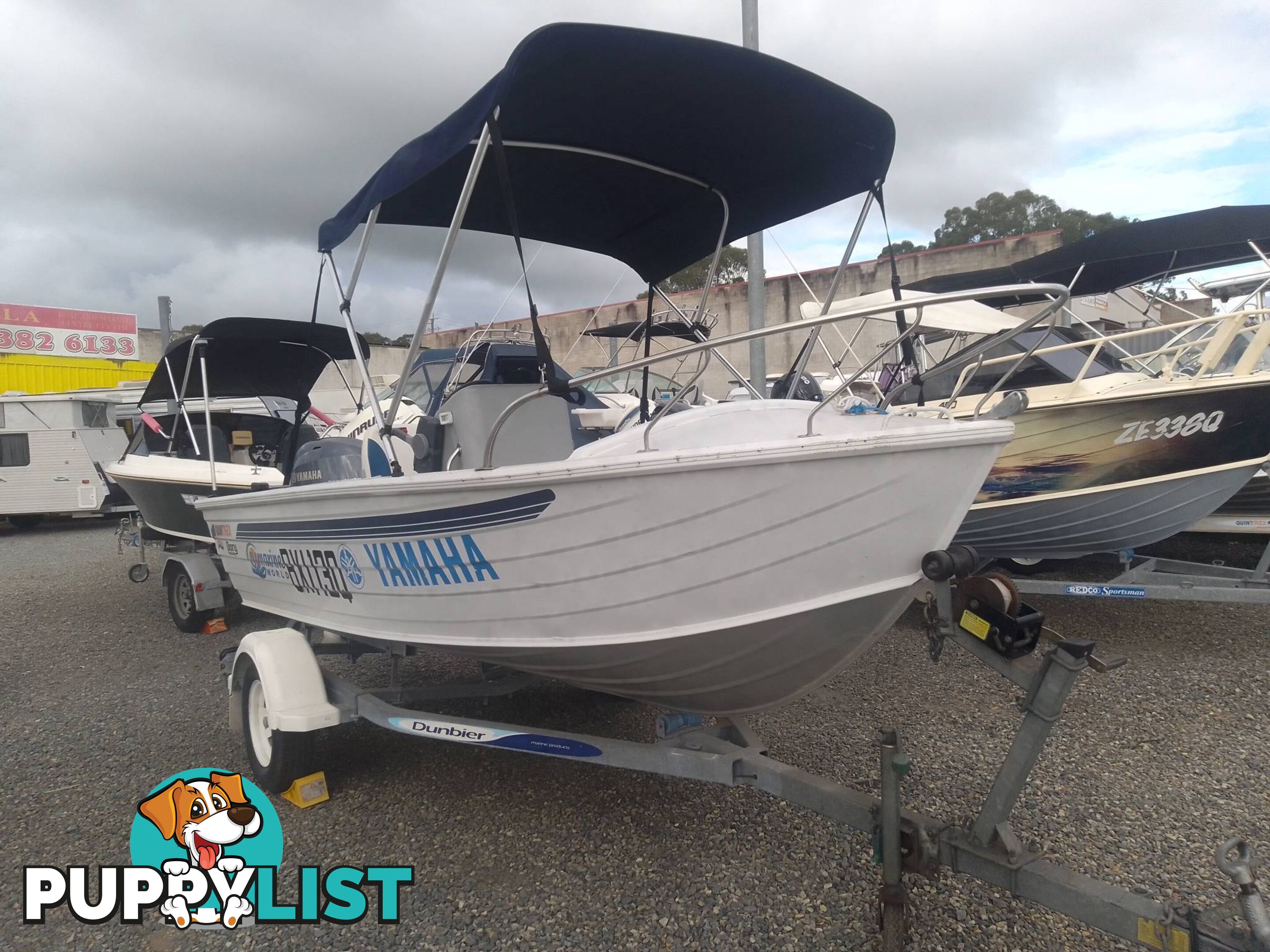 USED 2002 QUINTREX 4.2M CENTRE CONSOLE WIDE BODY DORY WITH A 40HP YAMAHA FOUR STROKE OUTBOARD ON A 2007 DUNBIER TRAILER.