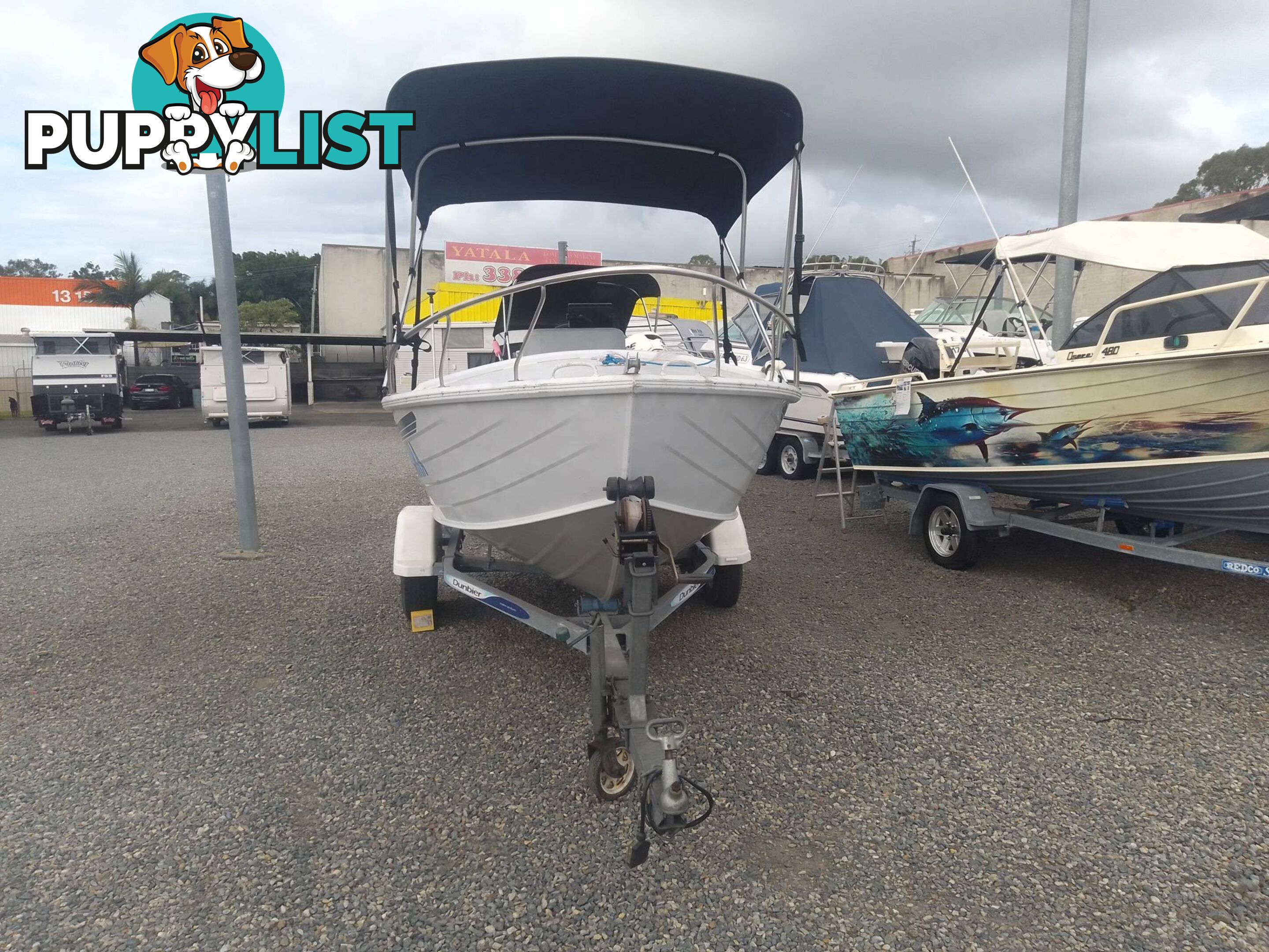 USED 2002 QUINTREX 4.2M CENTRE CONSOLE WIDE BODY DORY WITH A 40HP YAMAHA FOUR STROKE OUTBOARD ON A 2007 DUNBIER TRAILER.