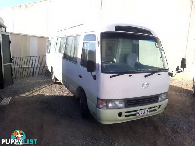 TOYOTA COASTER BUS DIESEL 6.6M TOURING MOTORHOME