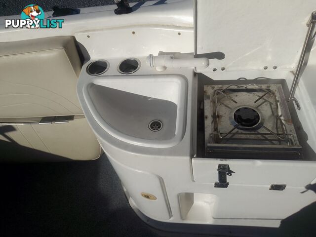 USED 2005 HAINES HUNTER 650 HORIZON HALF CABIN ON A 2005 EASYTOW DUAL AXLE TRAILER WITH A 215HP HONDA 4 STROKE OUTBOARD