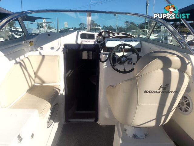 USED 2005 HAINES HUNTER 650 HORIZON HALF CABIN ON A 2005 EASYTOW DUAL AXLE TRAILER WITH A 215HP HONDA 4 STROKE OUTBOARD