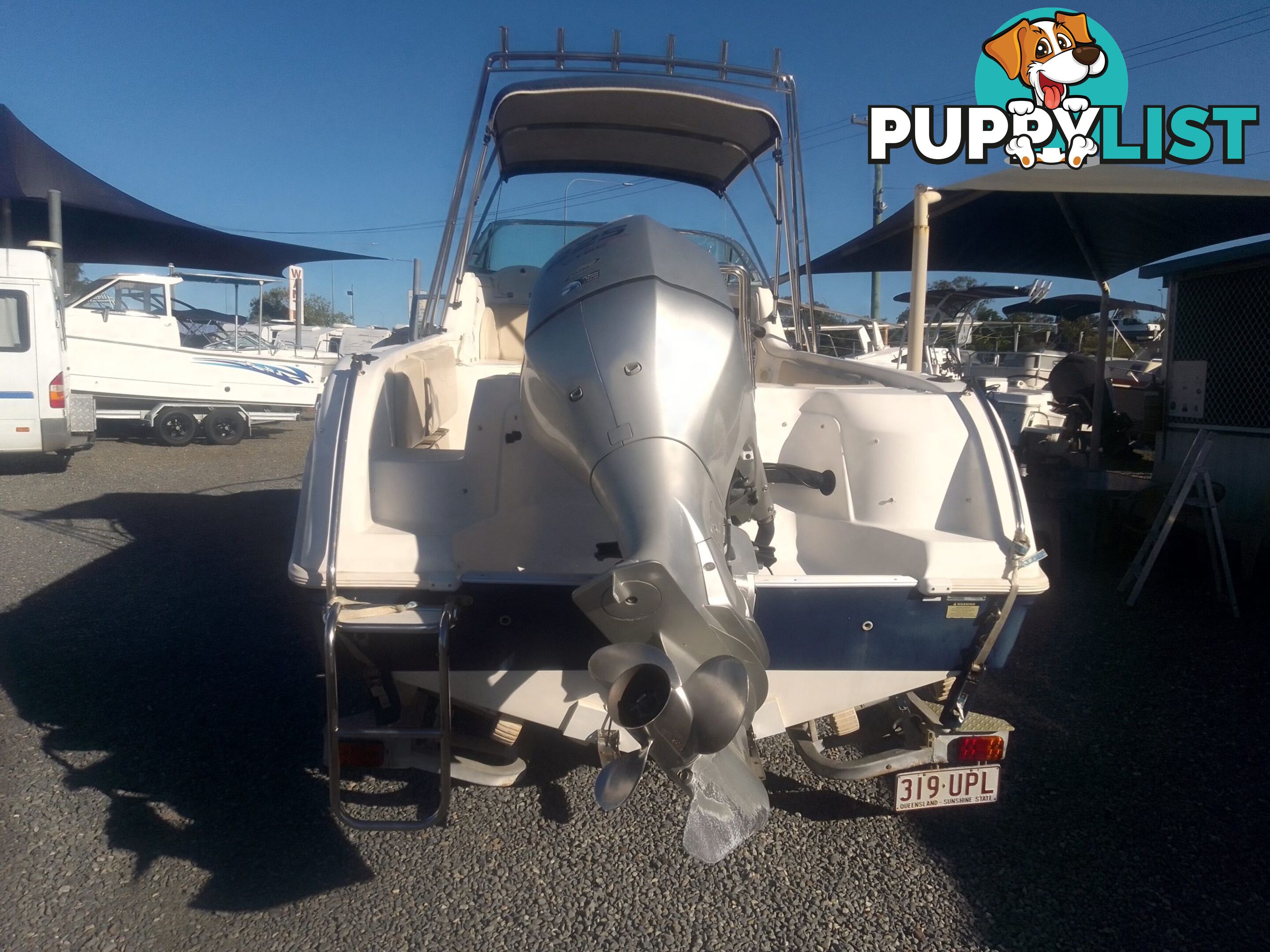 USED 2005 HAINES HUNTER 650 HORIZON HALF CABIN ON A 2005 EASYTOW DUAL AXLE TRAILER WITH A 215HP HONDA 4 STROKE OUTBOARD