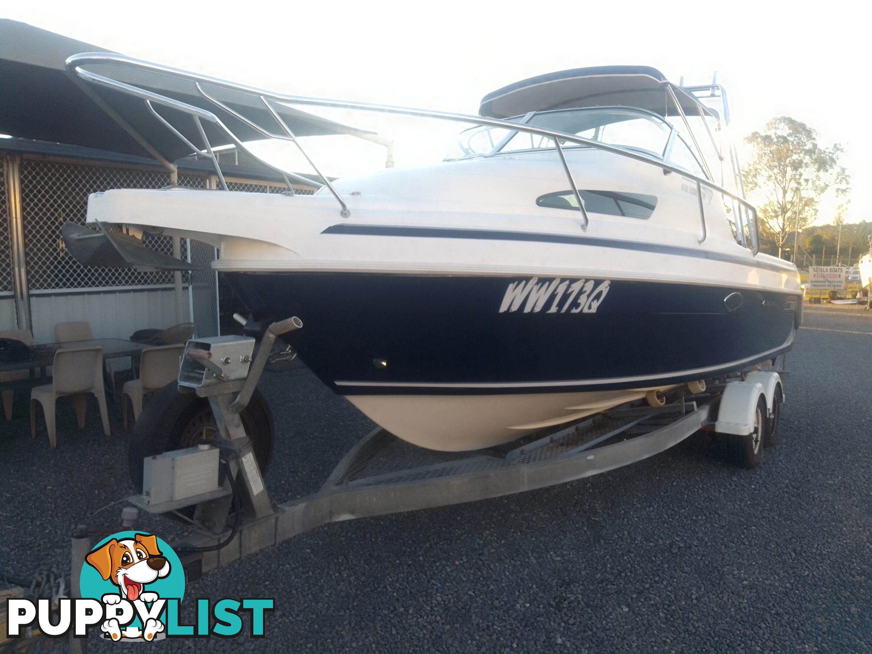 USED 2005 HAINES HUNTER 650 HORIZON HALF CABIN ON A 2005 EASYTOW DUAL AXLE TRAILER WITH A 215HP HONDA 4 STROKE OUTBOARD