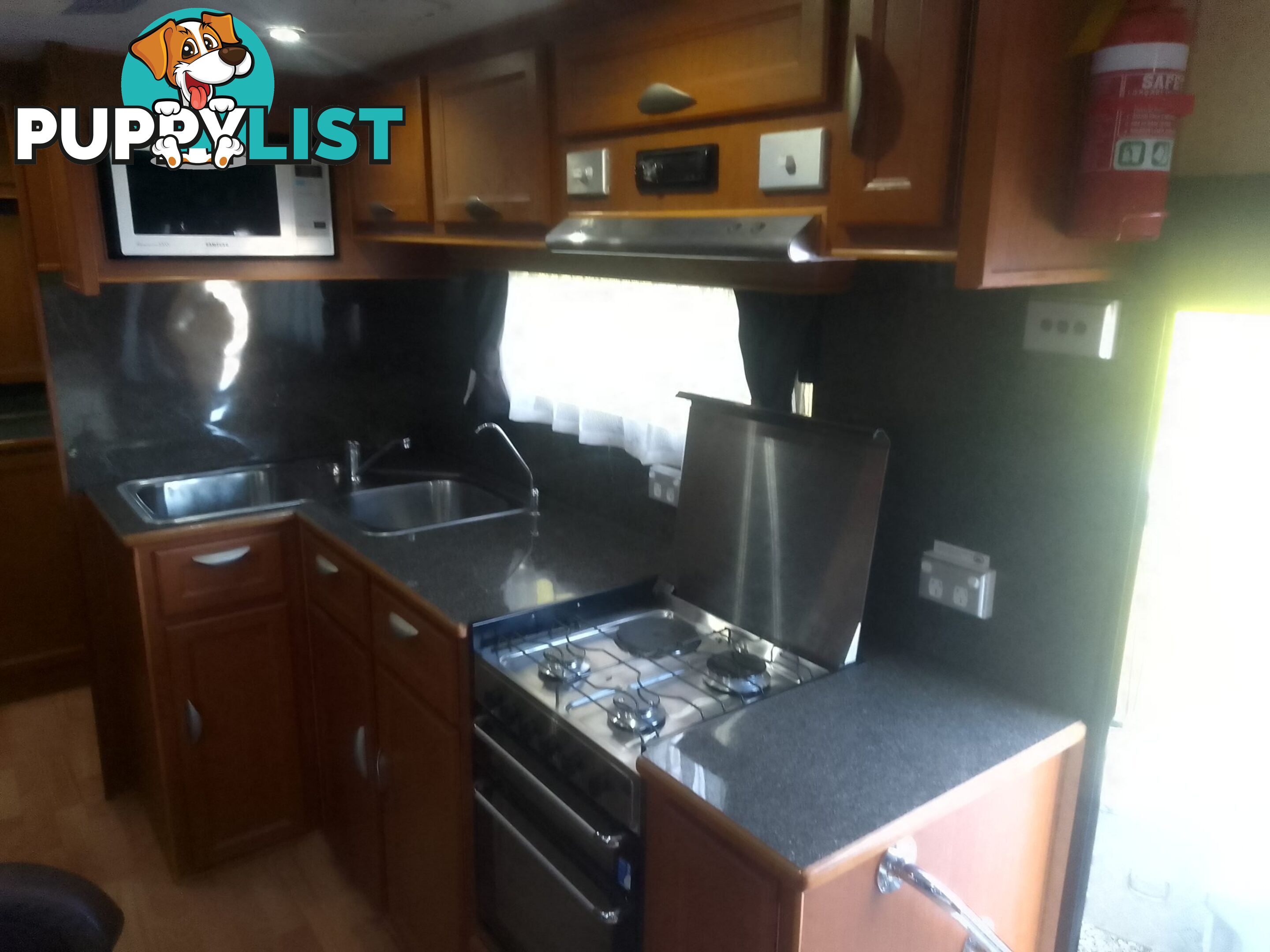 USED 2012 CRUSADER MANHATTAN 24'DUAL AXLE TOURING CARAVAN