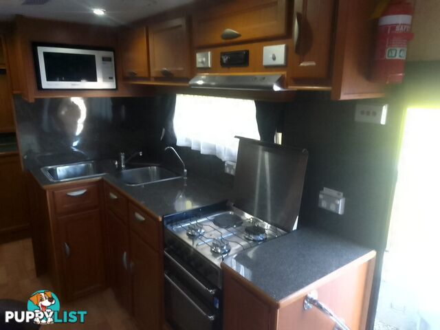 USED 2012 CRUSADER MANHATTAN 24'DUAL AXLE TOURING CARAVAN