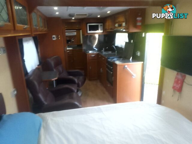 USED 2012 CRUSADER MANHATTAN 24'DUAL AXLE TOURING CARAVAN