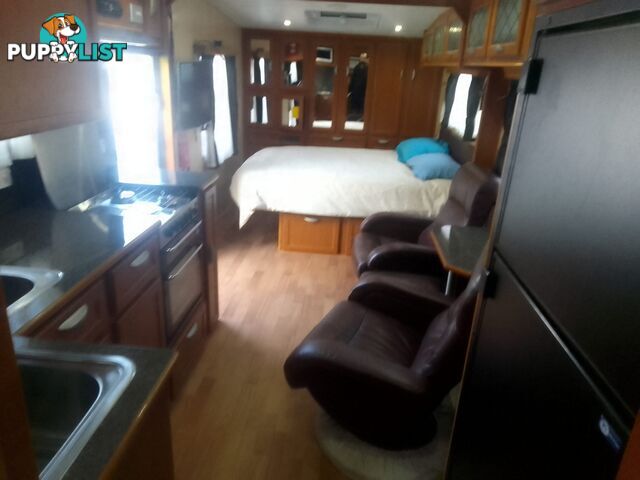 USED 2012 CRUSADER MANHATTAN 24'DUAL AXLE TOURING CARAVAN