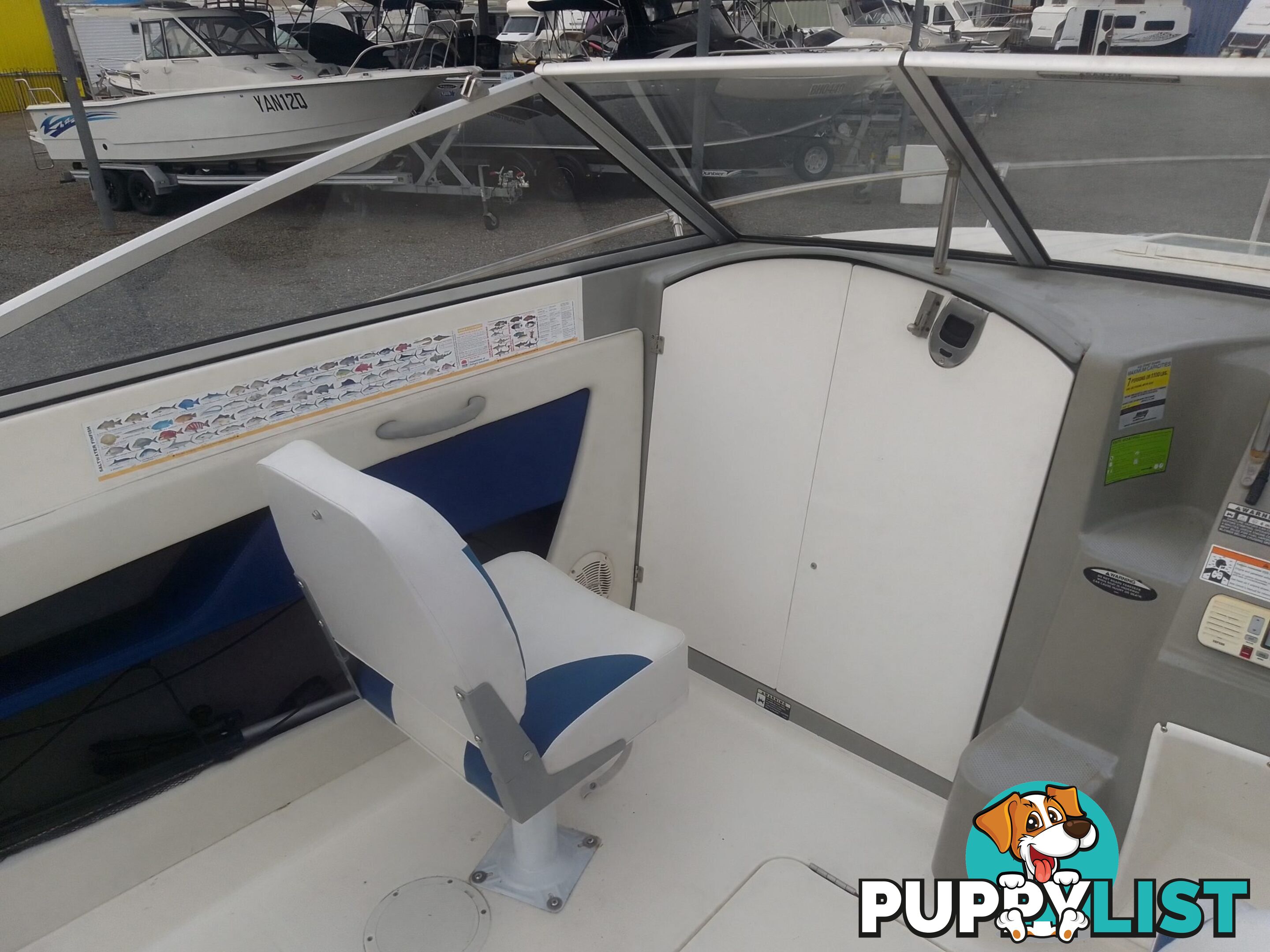 USED 2006 BAYLINER DISCOVERY CUDDY CABIN WITH A FOUR CYLINDER 135HP MERCRUISER ON A KARAVAN SINGLE AXLE TRAILER