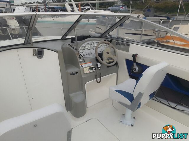 USED 2006 BAYLINER DISCOVERY CUDDY CABIN WITH A FOUR CYLINDER 135HP MERCRUISER ON A KARAVAN SINGLE AXLE TRAILER