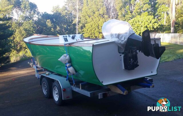 USED 2015 CUSTOM 7.00M COMPOSITE LAUNCH ON A DUAL AXLE TRAILER WITH A 2015 MODEL MERCURY OPTIMAX 175HP OUTBOARD.