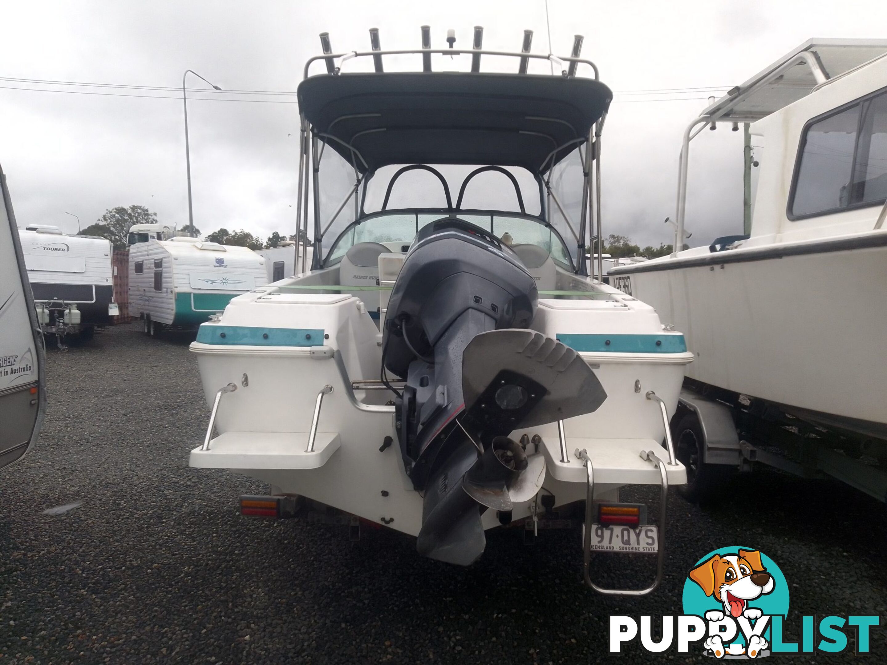 USED 2001 HAINES HUNTER 530 HALF CABIN ON A 2002 TINKA MULTI ROLLER TRAILER WITH A 115HP YAMAHA OUTBOARD.