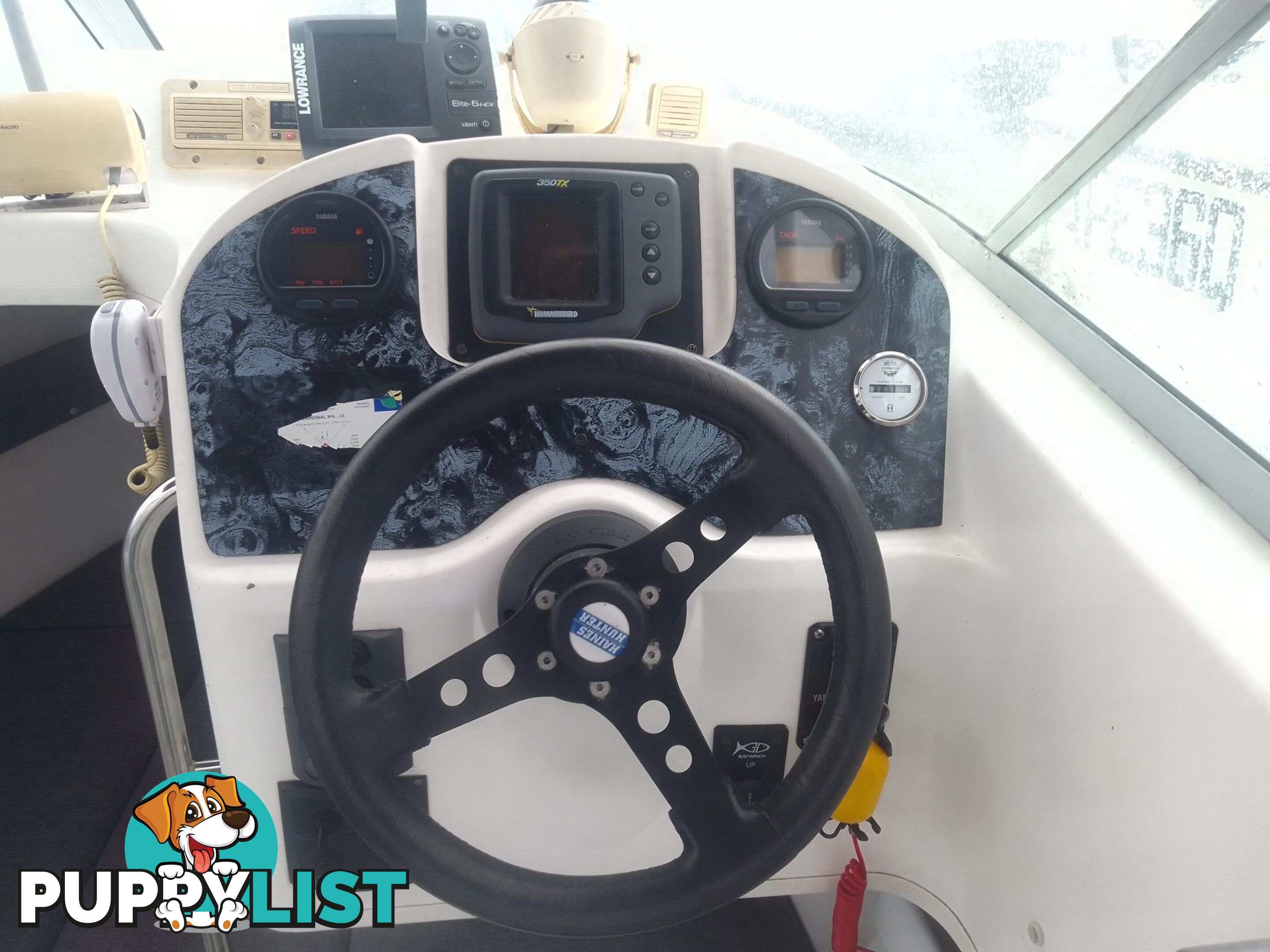 USED 2001 HAINES HUNTER 530 HALF CABIN ON A 2002 TINKA MULTI ROLLER TRAILER WITH A 115HP YAMAHA OUTBOARD.
