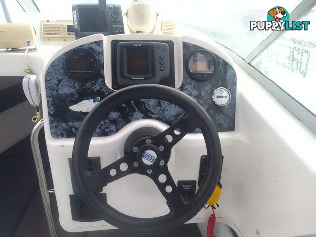 USED 2001 HAINES HUNTER 530 HALF CABIN ON A 2002 TINKA MULTI ROLLER TRAILER WITH A 115HP YAMAHA OUTBOARD.