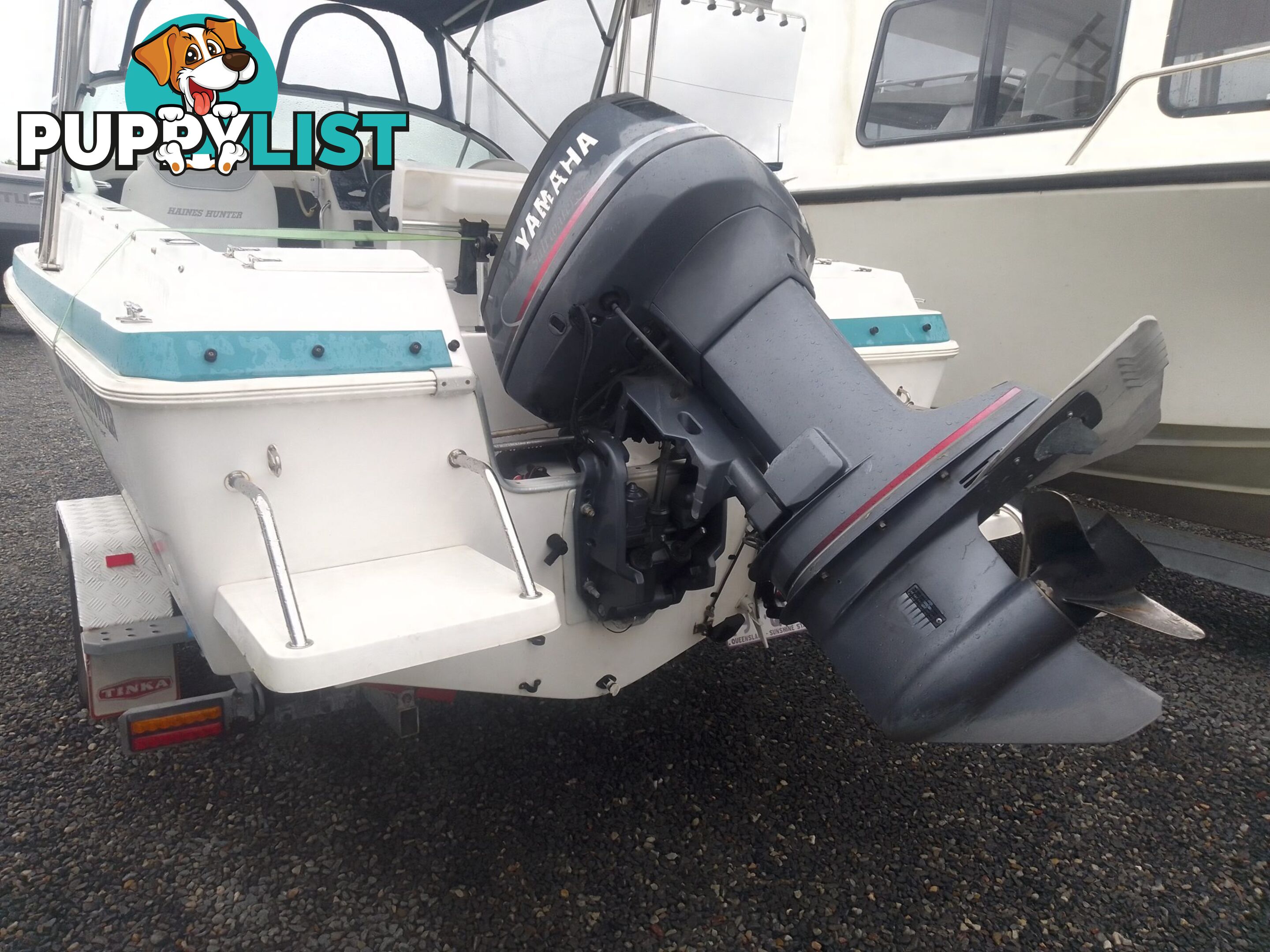 USED 2001 HAINES HUNTER 530 HALF CABIN ON A 2002 TINKA MULTI ROLLER TRAILER WITH A 115HP YAMAHA OUTBOARD.