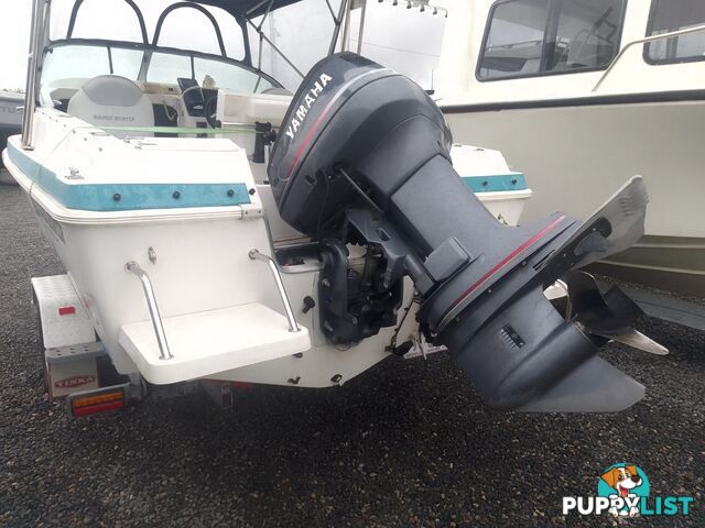USED 2001 HAINES HUNTER 530 HALF CABIN ON A 2002 TINKA MULTI ROLLER TRAILER WITH A 115HP YAMAHA OUTBOARD.